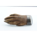 A 1920s silver-mounted otter paw brooch