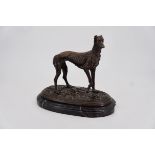 A cold-cast bronze figurine of a greyhound, 27 cm high