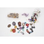 A quantity of un-mounted jewellery stones, cameos intaglios etc