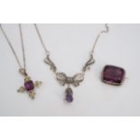 An amethyst-coloured stone and seed pearl pendant cross, a marcassite and amethyst coloured necklace