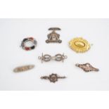 A quantity of Victorian and later brooches including an equestrian themed example, a silver Baby pin