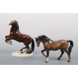 A Beswick horse together with one further rearing horse, 15 cm and 22 cm respectively