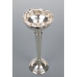 An early 20th Century silver spill / bud vase, with organic globular rim supported on a slender