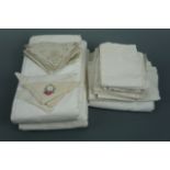 A quantity of antique and vintage whitework table linens, tea tray liners and napkins