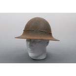 Two Second World War Fire Guards' steel helmets and a US M1 helmet liner