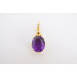 A 9 ct gold mounted oval facet-cut amethyst pendant, 2 cm, 1.5 g