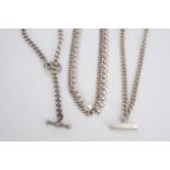Two contemporary white metal watch chain style necklaces together with a white metal fringe