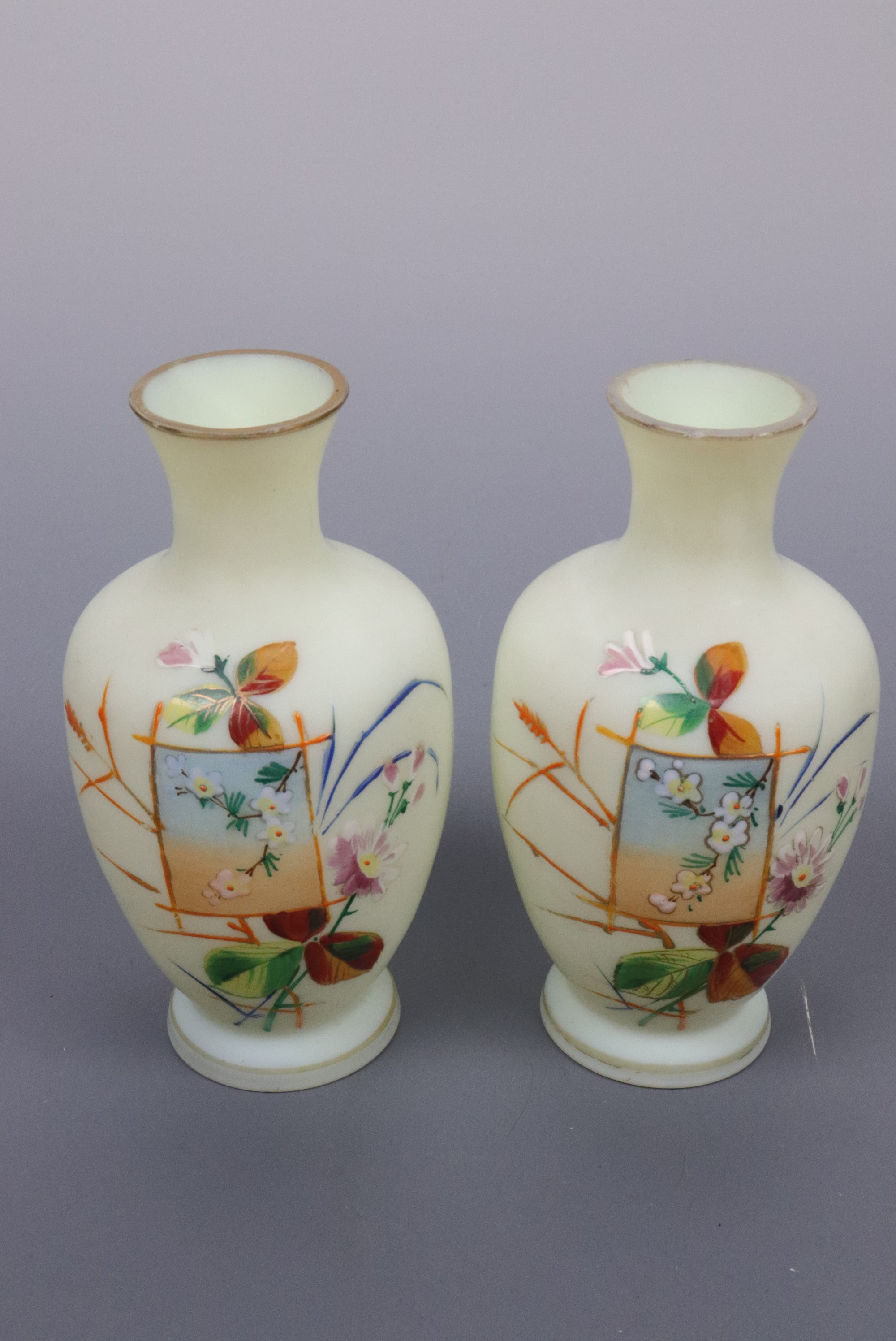 A pair of Victorian Aesthetic-influenced enamelled oviform glass vases, 14 cm