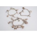 Three silver / white metal charm bracelets, 83 g