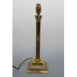 A brass columnar table lamp base, 40 cm high