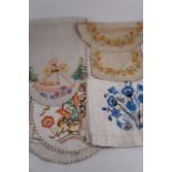 A quantity of vintage hand-embroidered decorative antimacassars