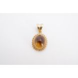 A 9 ct gold mounted citrine cabochon pendant, 2 cm, 1.4 g