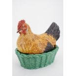 A Portuguese maiolica hen-on-nest crock, 28 cm x 26 cm high