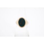 A 9 ct gold and bloodstone signet ring, the vacant oval matrix set within a fine reeded bezel, F/