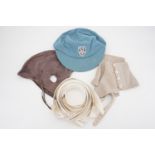 A vintage school cap, shirt collars, spats and a sporting cap