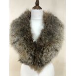 A vintage fox fur stole retailed by the Arctic Fur Stores of Newcastle-Upon-Tyne and one other fur