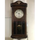 A 1930s mahogany cased wall clock, 80 cm