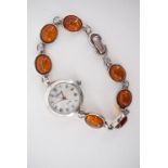 A lady's Chopin quartz wristwatch with amber cabochon and white metal bracelet strap