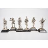 Five electroplate sculptures of Second World War soldiers and an RAF pilot, together with one