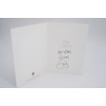 An autograph greetings card from Eric Clapton to a member of his management