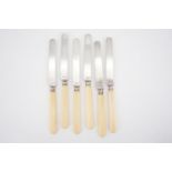 A set of six French white metal tea knives with ivory handles, bearing Minerva's head poincons,