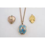 Three Victorian rolled gold pendant lockets, one turquoise-enamelled and decorated with a horse shoe