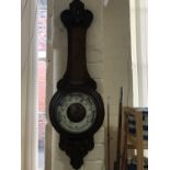 A Victorian carved oak aneroid barometer, 88 cm (a/f)