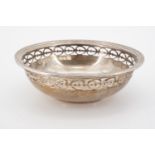 A silver bon-bon dish, circular, with everted rim flange and reticulated border, Walker & Hall,