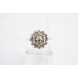 A diamond cluster ring having a 9 ct gold shank, O