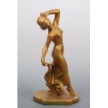 A 1930s gilt plaster figurine modelled as a female dancer, 38 cm