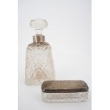 A late Victorian silver-collared cut glass perfume or toiletry bottle, of truncated pyramidal form