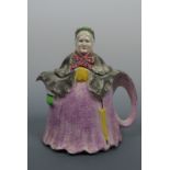 A novelty earthenware Little Old Lady teapot, the base bearing a registered design number, second