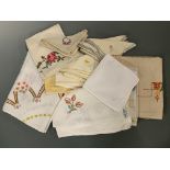 A quantity of vintage hand-embroidered table linens and napkins