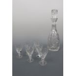 A glass spirit decanter and six sherry glasses