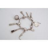 A Mexican white metal charm bracelet, circa 1960s, stamped Sterling 925, 48 g