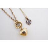 Two heart-shaped yellow metal pendants and neck chains, 4 g
