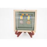 Framed British War and Victory medals to 35414 Pte T Mooney, Border Regiment