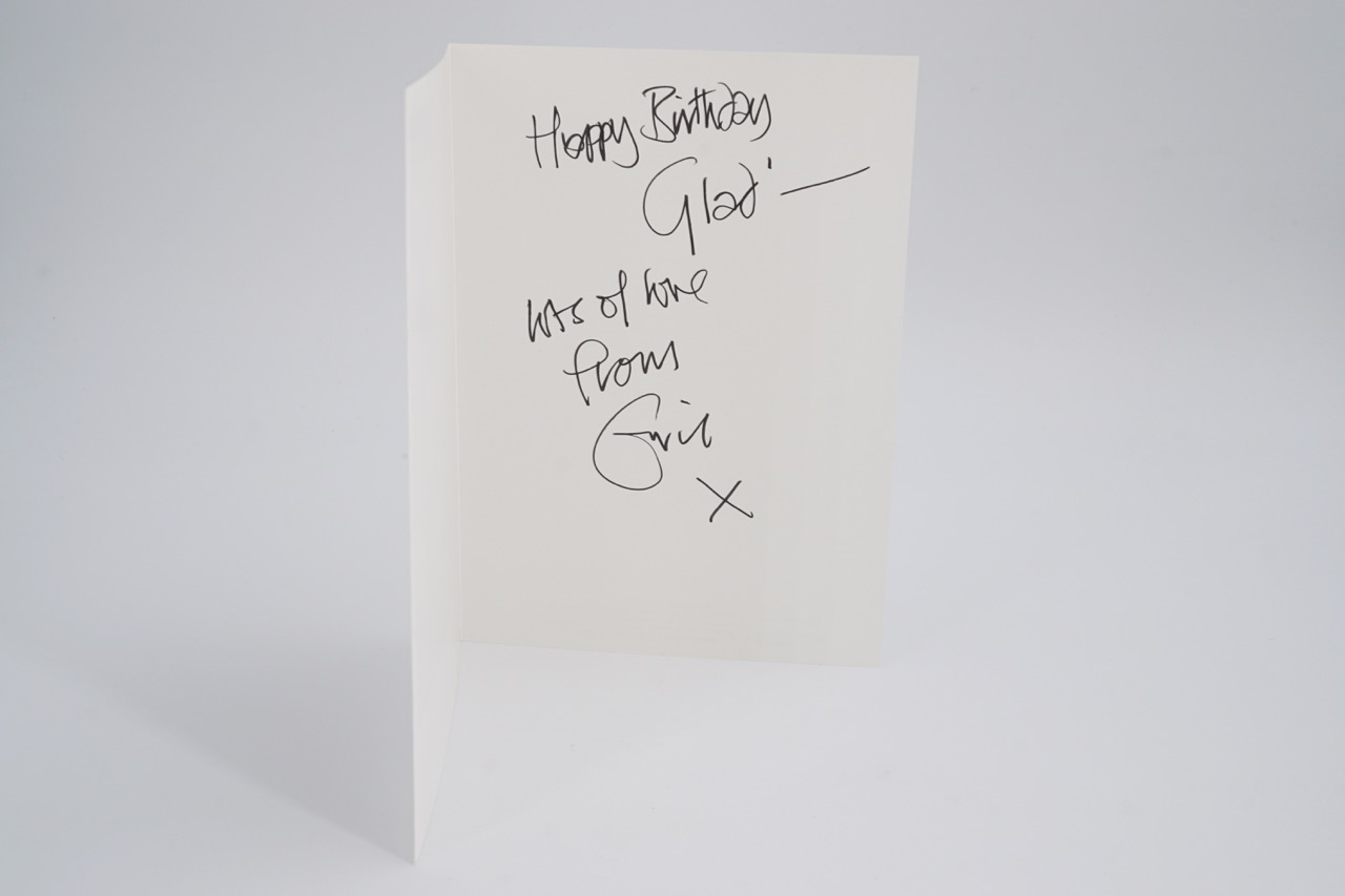 An autograph greetings card from Eric Clapton to a member of his management