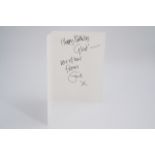 An autograph greetings card from Eric Clapton to a member of his management
