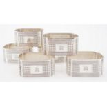 Six George V silver napkin rings, each of rectangular section with re-entrant corners and