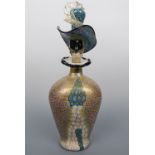 A fine Murano glass stylized figural decanter, the vessel of oval section, the stopper modelled as
