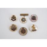Six mother-of-pearl sweetheart brooches