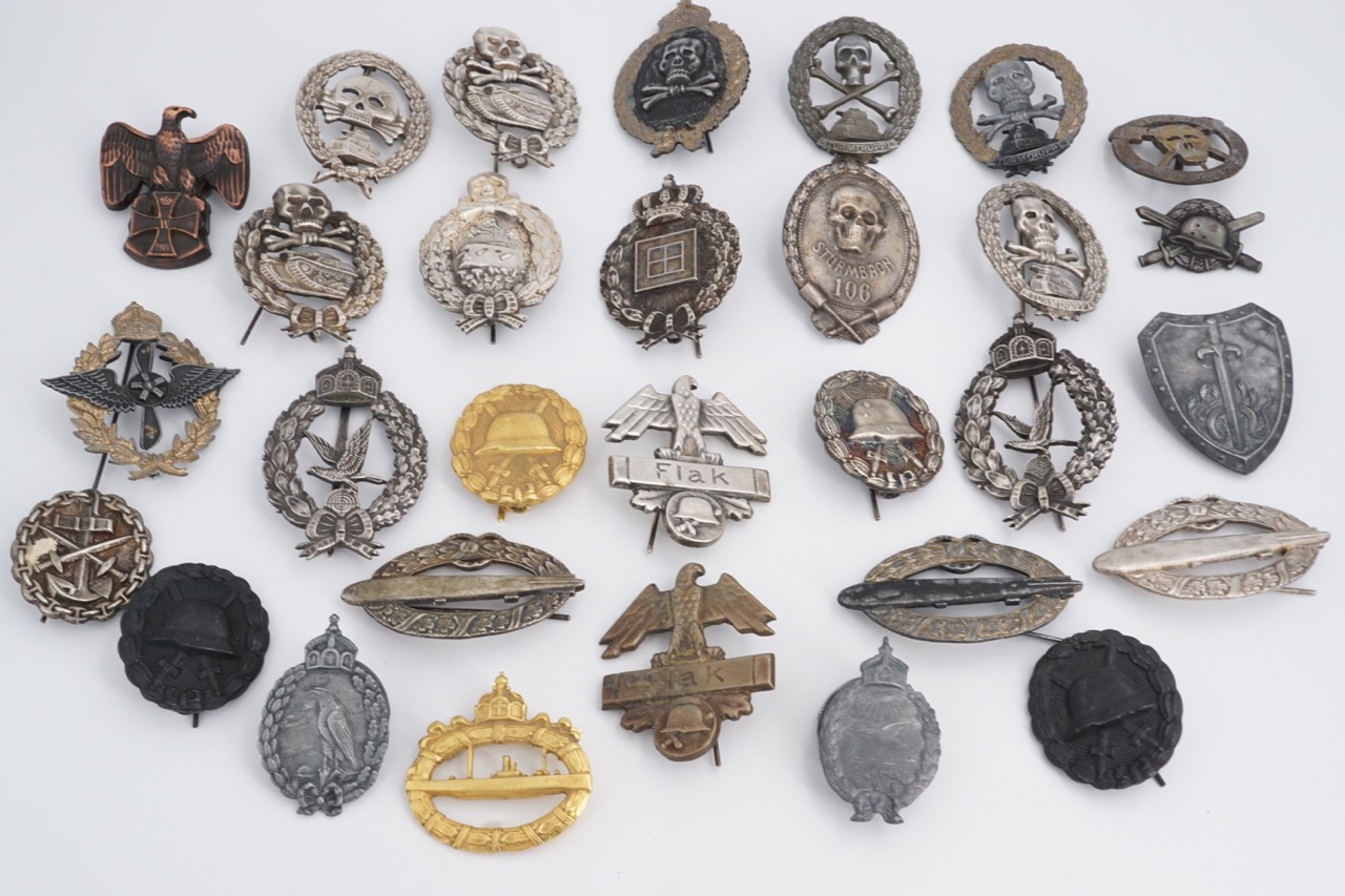 A large quantity of reproduction Imperial and Third Reich German military insignia