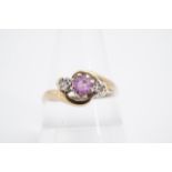 A diamond and pink topaz finger ring, the stones twist-set on a 9 ct gold shank, Q/R