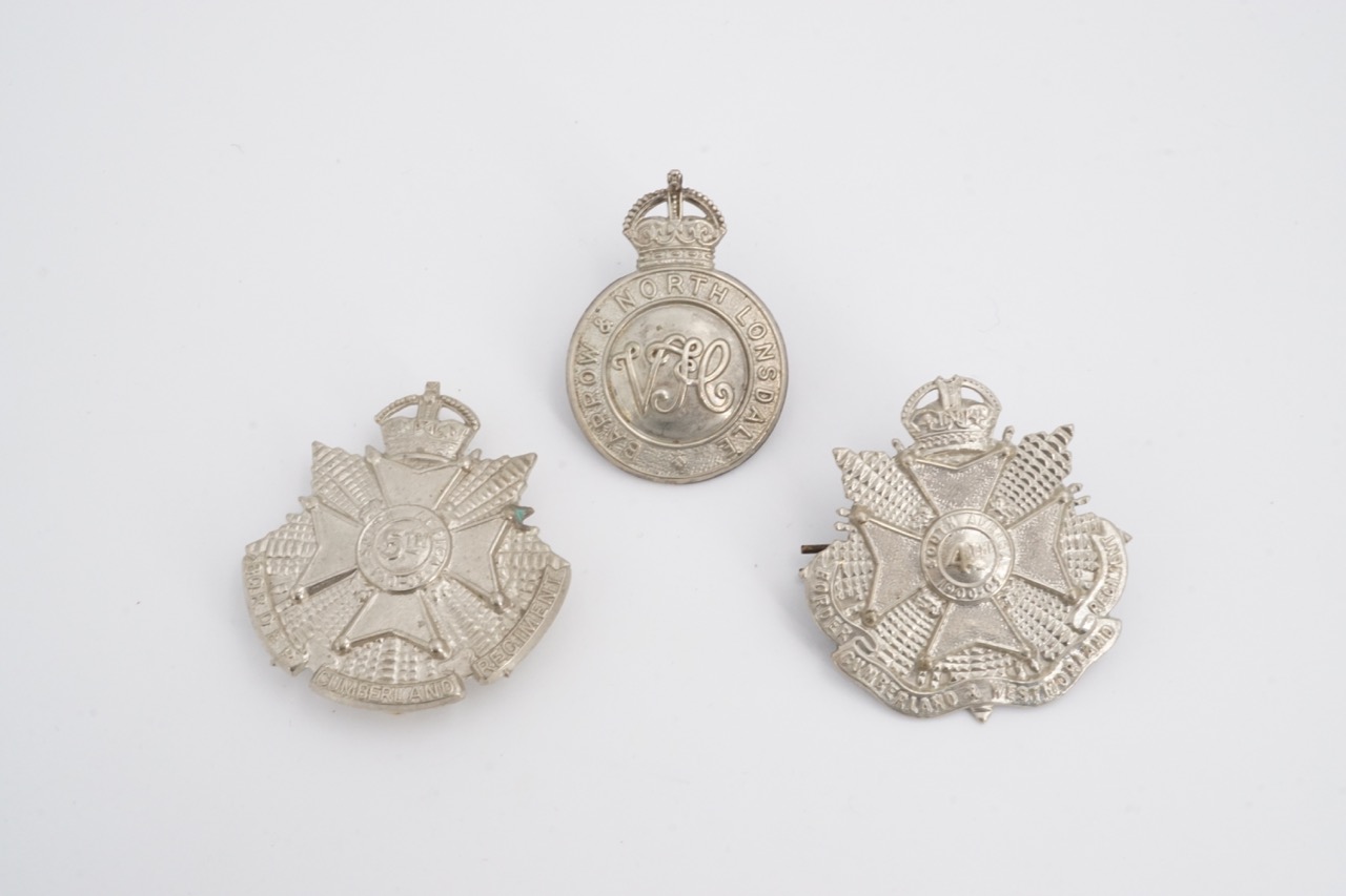 4th and 5th Battalion Border Regiment cap badges together with a Barrow and North Lonsdale VTC cap