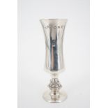 A 1977 silver champagne flute or vase, having a slender waisted bowl and short knopped stem, the