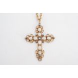 An opal and diamond pendant cross, the open-work and scroll cross set with 9 oval opal cabochons and