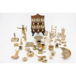 A quantity of brassware including a pair of miniature canons, nested weights, miniature cups and