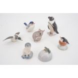 Seven Royal Copenhagen miniature figures including a penguin, 8 cm high, a duck, a mouse, and a frog