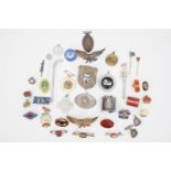 A large quantity of badges, fobs etc